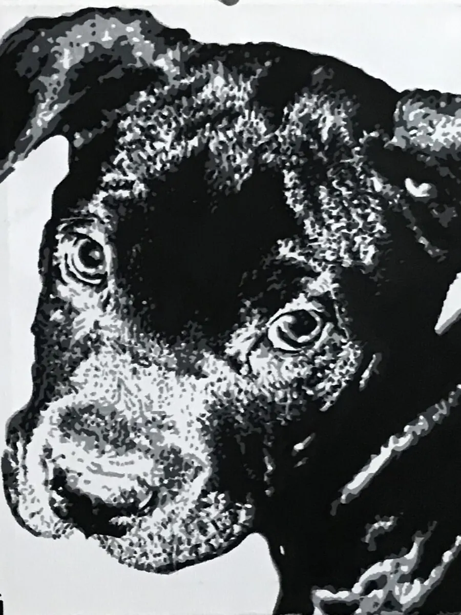 Black and white acrylic portrait of a black dog with its head tilted