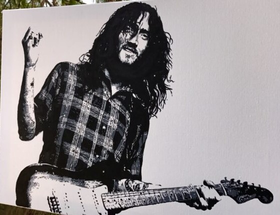 Hand-painted portrait of a guitarist, acrylic on canvas